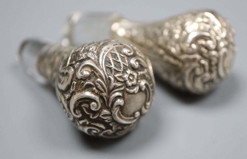 A pair of Edwardian pierced silver mounted waisted decanters, Henry Matthews, Birmingham, 1906